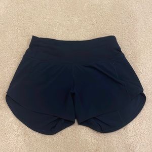 Lululemon Speed-Up Shorts 4” in True Navy. These are a size 0 tall.